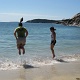 Jen and Darlene jumping the wave.