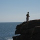 Jen climbed to the top of a boulder next to the Thunder Hole.