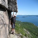 Stevo holding the boulder up for Kim to pass.