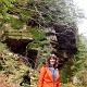 Darlene infront of a cool rock wall.