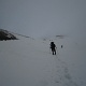 Pushing on in low visibility. We ended up made camp at the ridge above us.