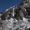 Guys ice climbing.